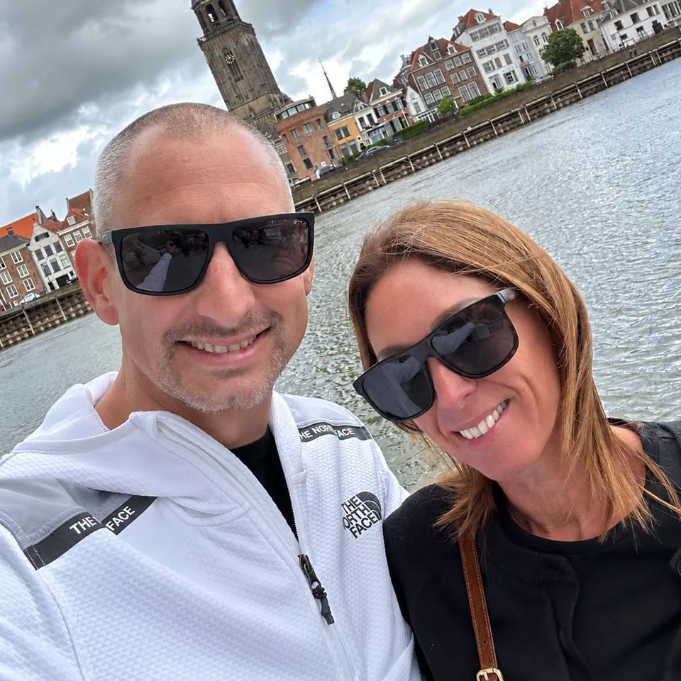 Mark and Keely smiling together by the river